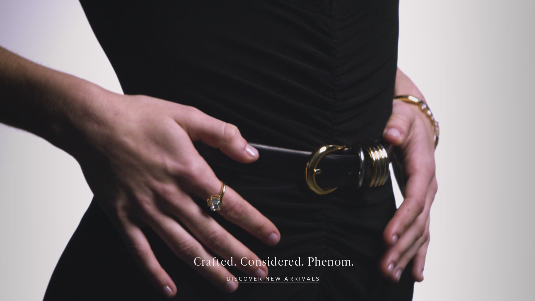 Video of a model wearing a sleek black one-piece jumpsuit and Nadri's Phenom jewelry collection.  She is moving slowly  and the camera is focused on the jewelry which features emerald cut cubic zirconia stones and polished metal details. The text reads "Crafted. Considered. Phenom" and there is a button that says "Discover 168飞开艇开奖福彩五分钟-福彩168飞行艇体彩查阅-飞行艇幸运今日体彩预测结果»»".