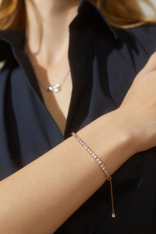 image of model wearing the love all adjustable tennis bracelet